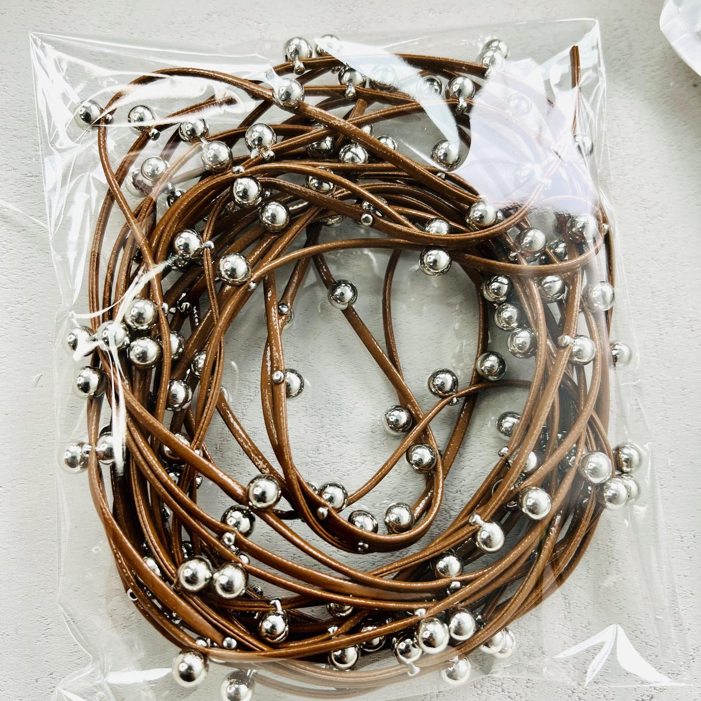 leather with metal balls rope